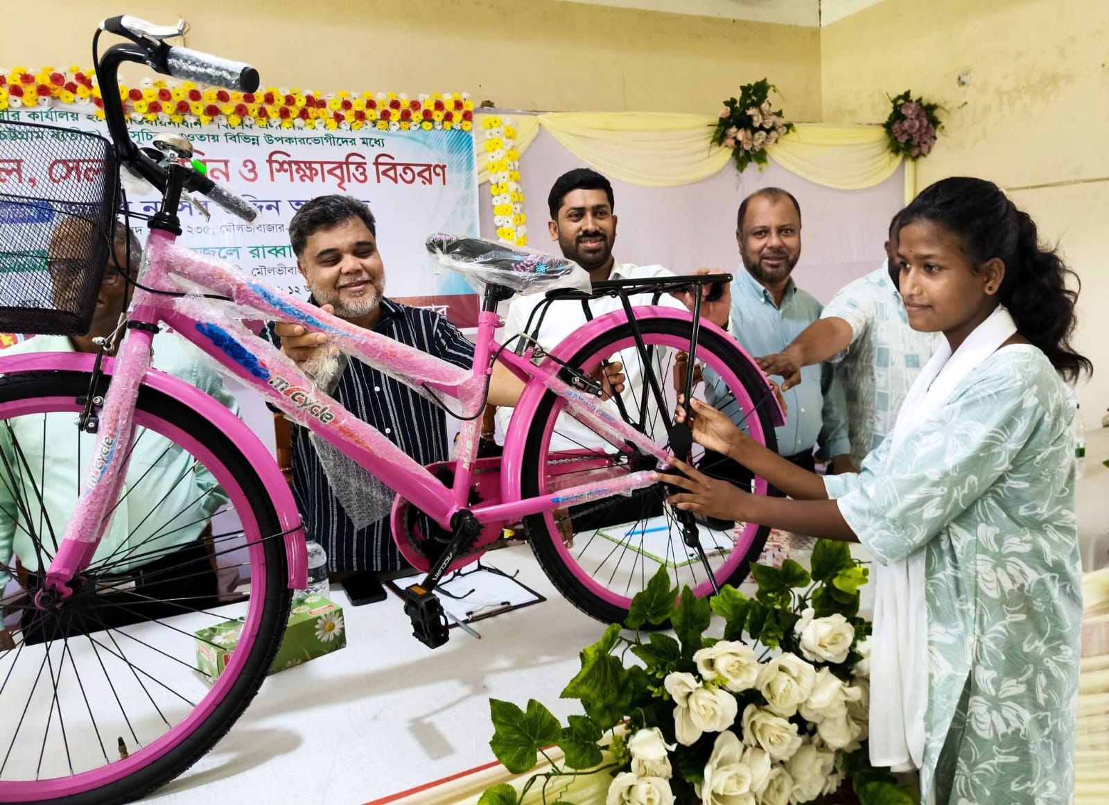 39 students receive bicycles, 59 women sewing machines in Juri Upazila 